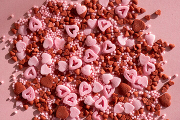Multi-colored candies in the shape of hearts  close-up, full frame, selective focus. Postcard for Valentine's Day