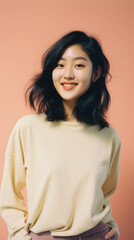 Portrait of young asian woman with smile on pink background .