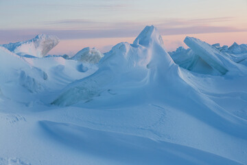 Winter arctic landscape. Cold frosty winter weather. Harsh polar climate. Ice hummocks on the...