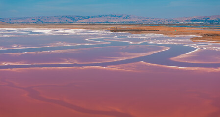 Aerial view of the Pink salt ponds at Alviso Marina County Park, gateway to the Don Edwards San Francisco Bay National Wildlife Refuge