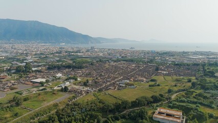 Fototapeta na wymiar Pompeii, Italy. Pompeii is a large ancient Roman city, now a large-scale archaeological complex. General view from above, Aerial View