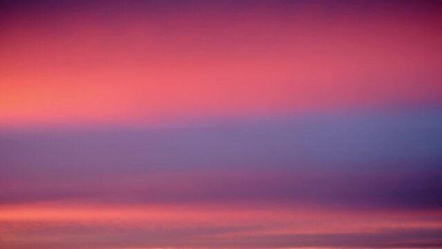 Abstract background of beautiful pink and violet sunset sky with clouds, timelapse