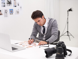 Photographer, thinking and man editing in office with computer to process, production and catelog images. Professional, editor and creative person with laptop and photoshoot results of cinematography