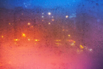 Winter frost patterns on glass. Ice crystals or cold winter background.