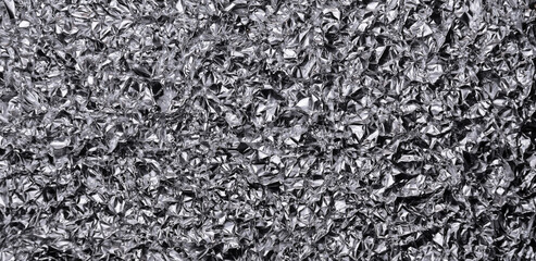 Silver metallic crumpled aluminum foil background