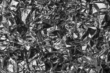 Silver metallic crumpled aluminum foil background