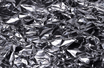 Silver metallic crumpled aluminum foil background