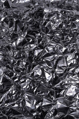 Silver metallic crumpled aluminum foil background