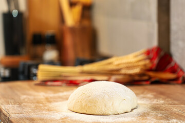Sourdough bread. Homemade bread dough left to rise on the wood counter top inside a kitchen. Home bread making photo Bread baking.
