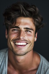 Fototapeta premium Handsome young smiling man black background