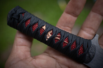 Red and black colure with tanto knife handle wraping
