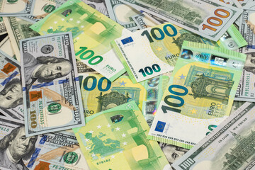 Hundred dollars and euros bills. Finance concept background