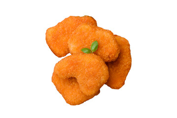 Delicious fresh crispy chicken nuggets on a dark concrete background