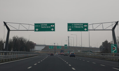 motorway video in northern Italy with indications for the border of Austria or Slovenia and more...