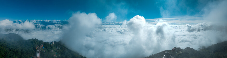 Aerial view of Himalayan mountain range seen from Nagarkot surrounded by clouds. The highest...