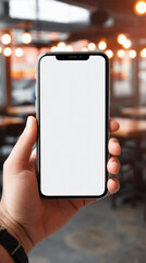 Male hand holding smartphone with blank screen in cafe, mockup