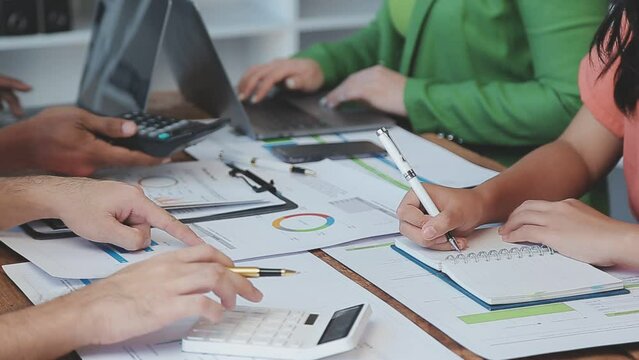 Close-up asia business people meeting plan analysis statistics brainstorm and header of team hold tablet pointing graph chart and employee take note. Finance strategy statistics success concept.