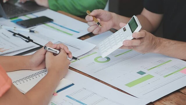 Close-up asia business people meeting plan analysis statistics brainstorm and header of team hold tablet pointing graph chart and employee take note. Finance strategy statistics success concept.