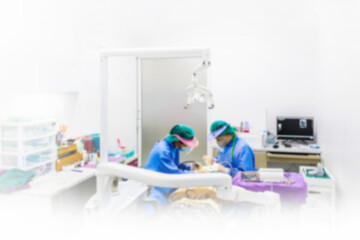 Dental clinic background professional equipment Doctor giving dental treatment to patient Blurry background
