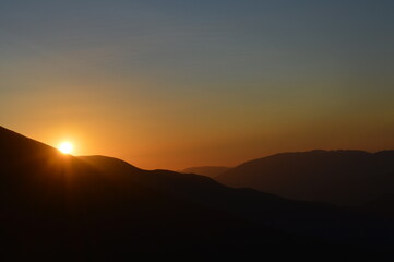 Naklejka na ściany i meble Sunset over the high Atlas Mountains