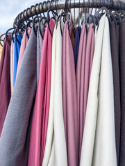 colorful clothes or scarf on hangers