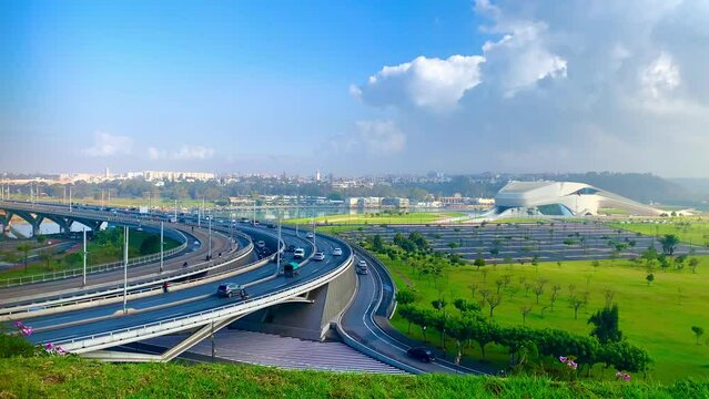 4K of  Traffic on Hassan II bridge in Rabat, Morocco and  The Grand Theatre of Rabat with a public park in the foreground and OUED BOU REGREG in Morocco