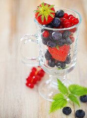 Delicious fresh fruits in the glass cup
