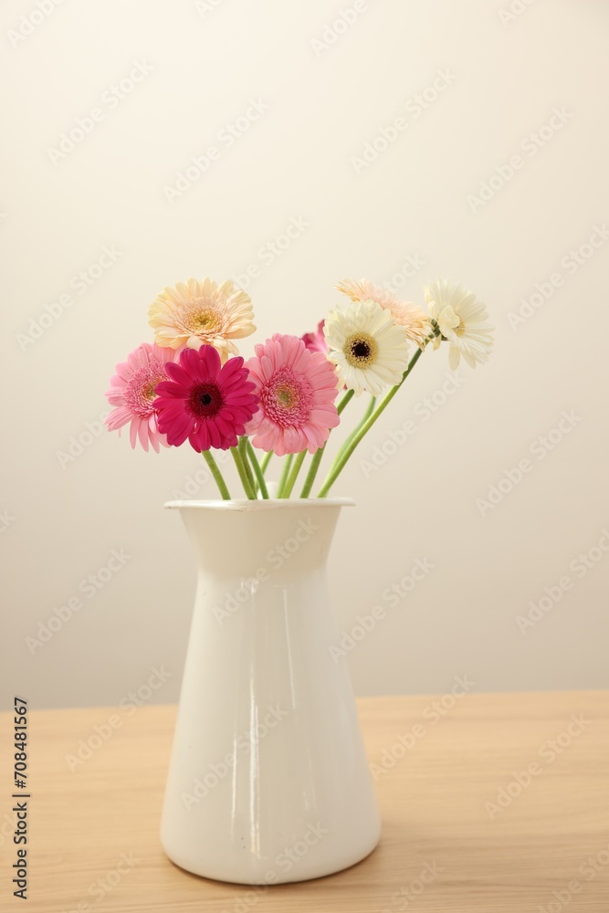 Canvas Prints Vase with beautiful gerbera flowers on wooden table