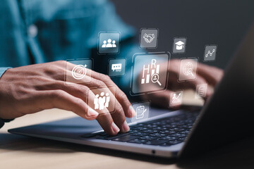 Human Resources HR management concept. Businessman use laptop with virtual people analysis icons...