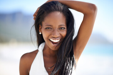 Portrait of black woman on beach, holiday and smile with blue sky, sunshine and tropical island...