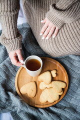 person holding a cup of tea