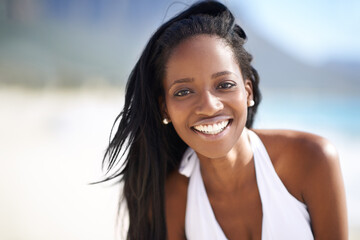 Portrait of black woman on beach, relax and smile on holiday with travel, sunshine and tropical...