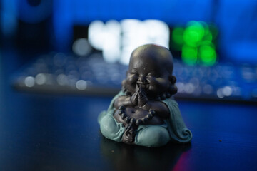 Buddha figurine on the desk 