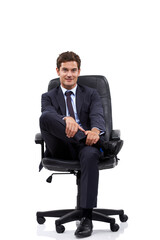 Happy, businessman and portrait of manager in a chair with white background or mock up space in studio. Confident, entrepreneur and relax on seat with professional style, fashion or suit for work