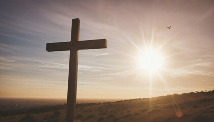 Silhouetted Christian Cross against Sunset Sky