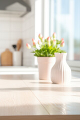 A softly blurred interior scene featuring a vase of tulips bathed in natural sunlight with a warm and inviting ambiance.