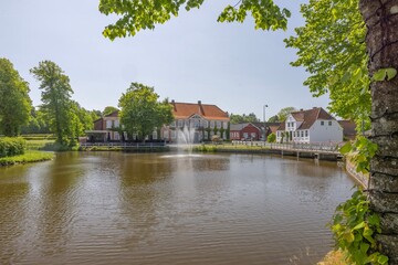 Obraz premium Gram Slot's agriculture is continuously being developed with cattle farms and arable land, where a multitude of different crops are grown such as island wheat.Southern Jutland,Denmark