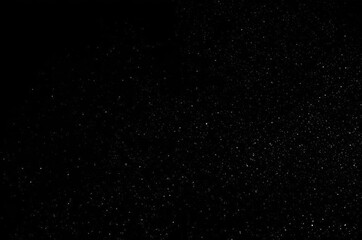 Fototapeta premium Dust and scratches on a black background.