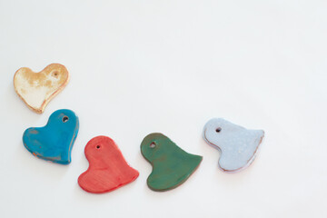 Love and diversity. Multicolored heart shaped ceramic pieces