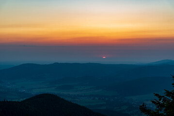 Sunrise from Cervena hora hill in Jeseniky mountains in Czech clouds