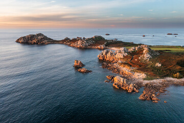 .Drone view of Primel Tregastel, ocean coast in France, Brittany at sunset.