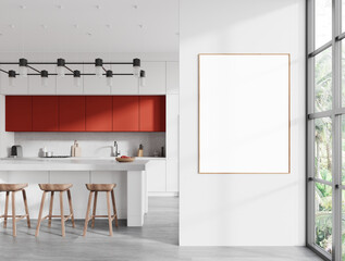White and red kitchen interior with island and poster