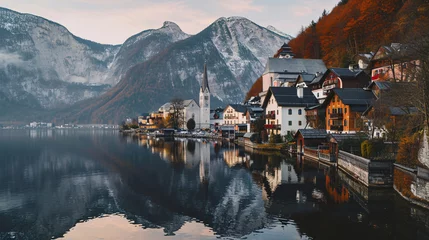 Fotobehang Mountains and turquoise sky  with traditional houses reflected in the water of the lake. © ikkilostd