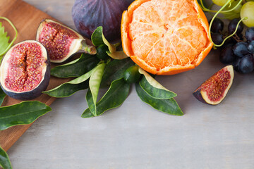 Nutrition. Fruit background border on grey wooden board. Organic food