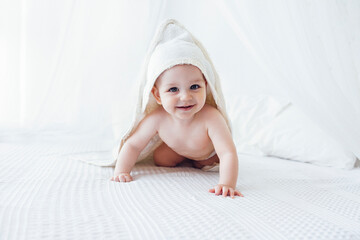 Little cute child wearing hooded towel after bath or shower. - Powered by Adobe