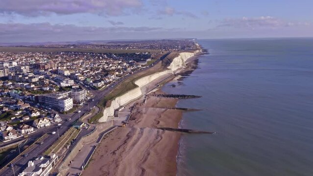 Aerial video of the White Chalk Cliffs at Saltdean in East Sussex heading west towards Peacehaven along the undercliff walk.