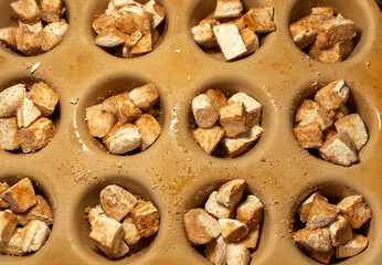 Uncooked cinnamon pastry made from chunked dough
