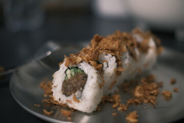 Sushi
In an iron plate, there are delicate sushi pieces arranged, featuring vibrant colors and exquisite shapes, portraying an enticing scene of delicious Japanese cuisine.