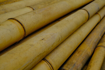 Background Photography. Textured Backgrounds. Texture detail of old yellow bamboo. Old bamboo is collected on the side of the road for building construction. Bandung, Indonesia