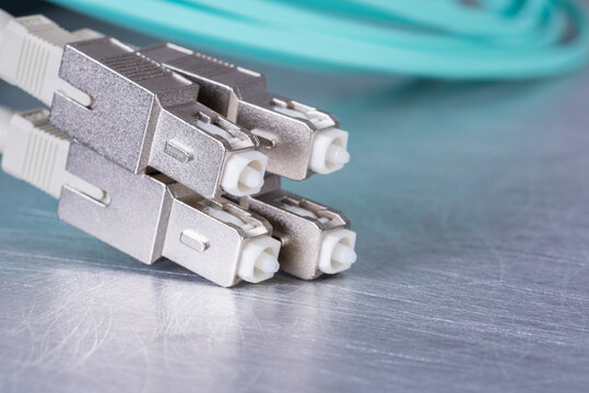 Fiber optic patch cords on metal surface